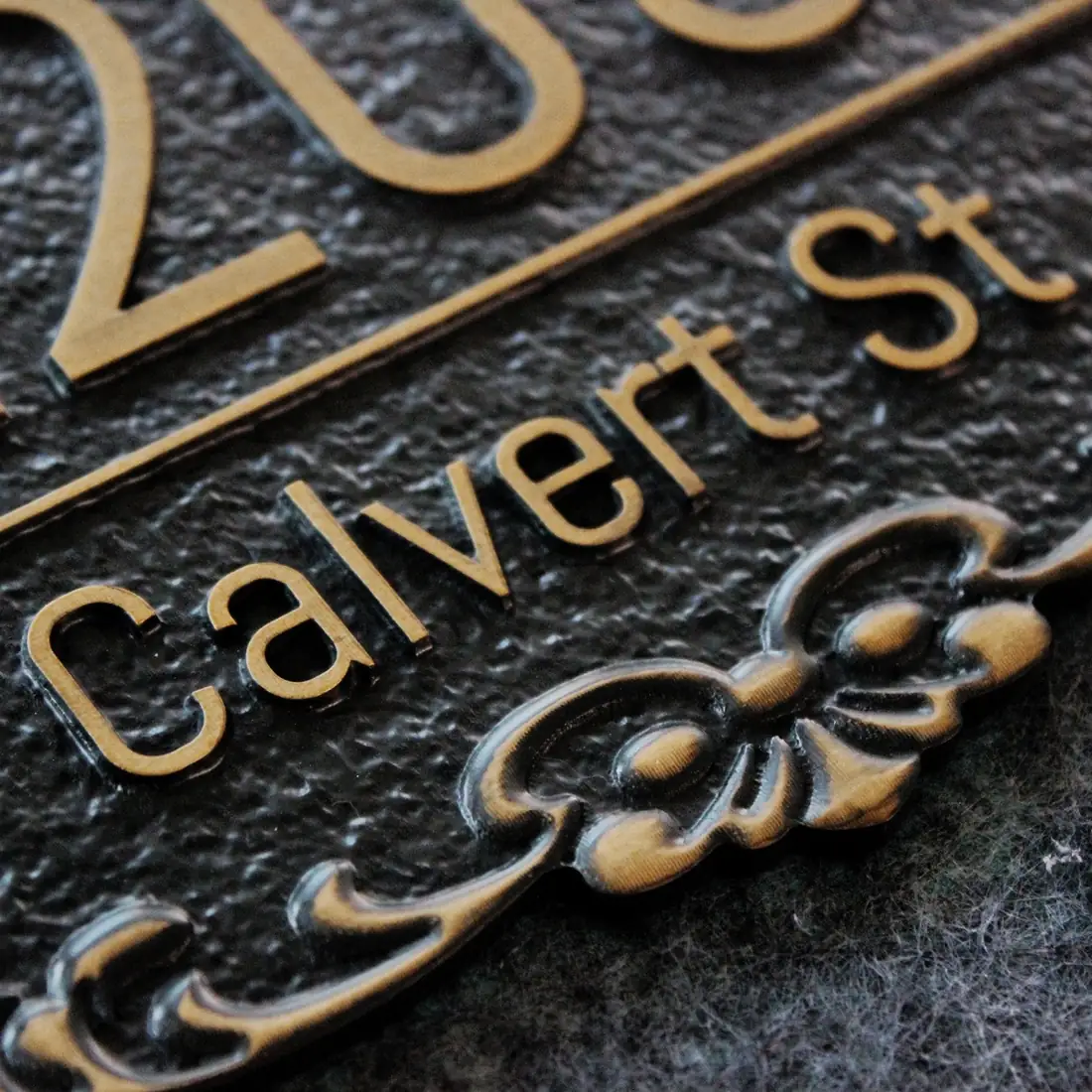 Antique bronze outdoor address plaque with raised lettering