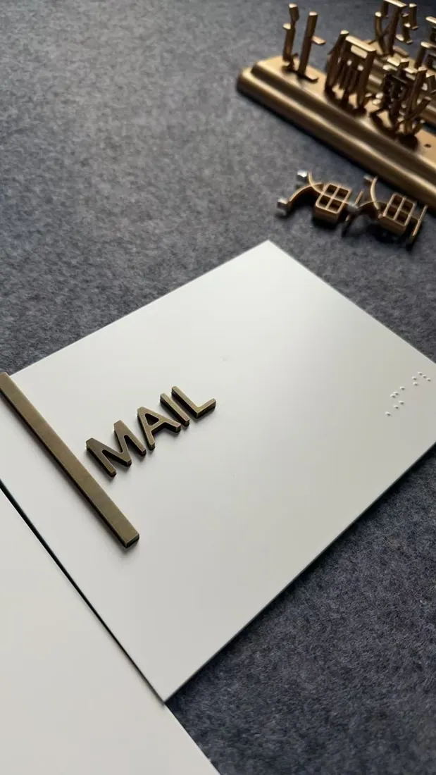 Acrylic and aluminum layered tactile sign construction sample