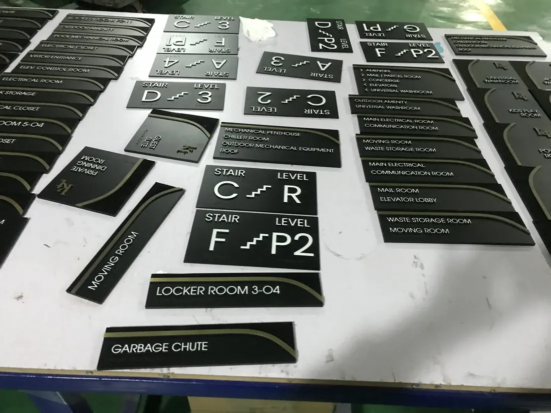 Braille and tactile room sign set with raised lettering and room numbers