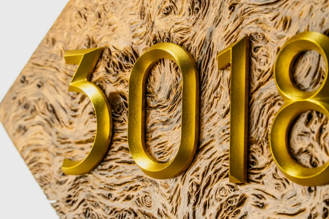 Raised gold dimensional number 2018 with polished surface detail