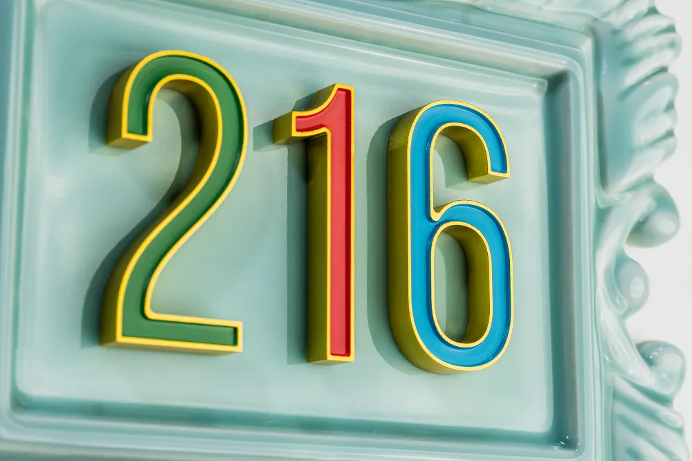 Pastel relief dimensional number 216 with custom colored numerals