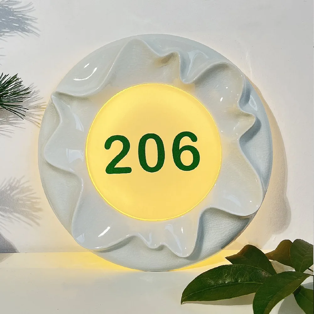 Y002 white glazed ceramic flower-shaped room number 206