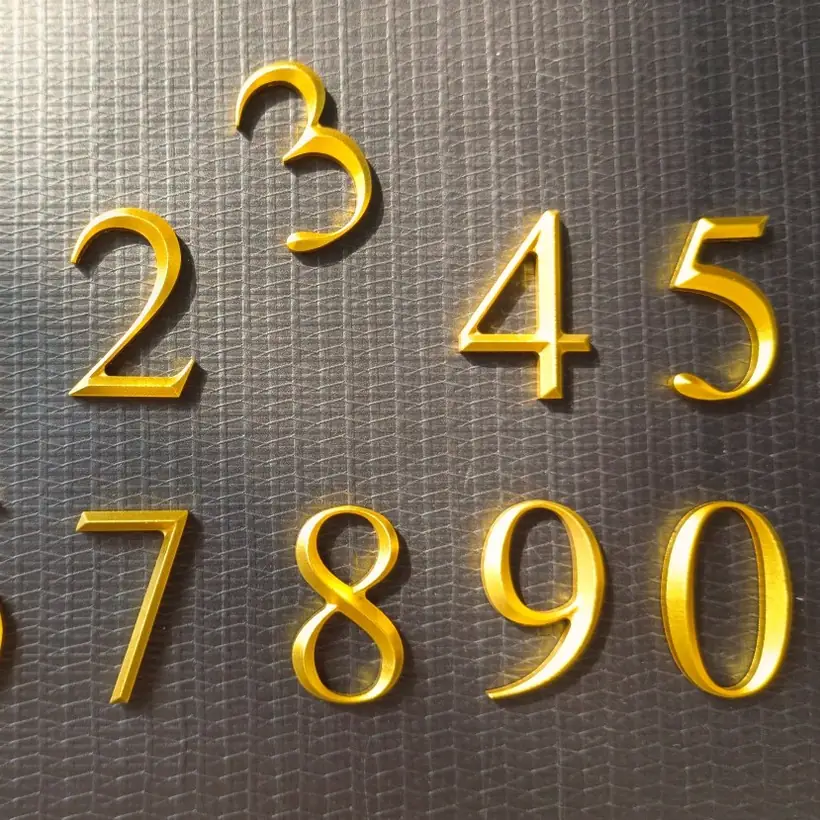 Gold dimensional number set for apartment doors