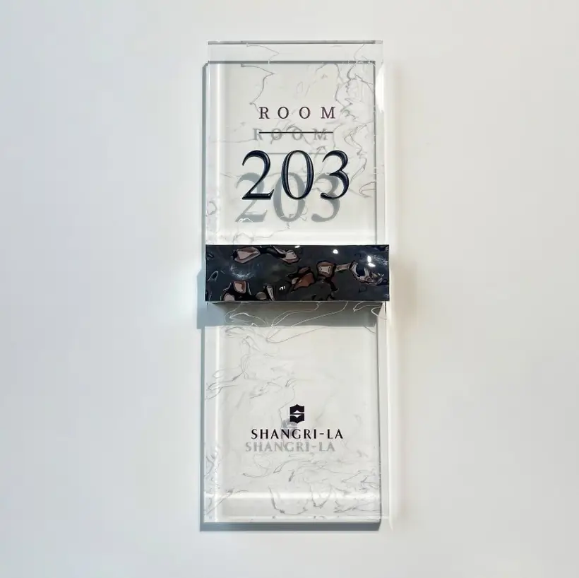Hotel room number plaque reference used for ADA tactile and decorative buying notes