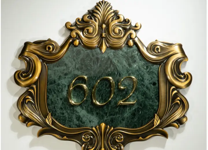 Custom carved relief plaque with ornate raised border